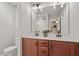 Bathroom featuring double sink vanity with granite countertops, modern fixtures and commode at 21 Cambridge Dr, Angier, NC 27501