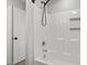 Bright bathroom with a white shower and white walls with door to enter at 21 Cambridge Dr, Angier, NC 27501