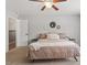 Cozy bedroom with ceiling fan, neutral walls and carpet, with decorative wall art at 21 Cambridge Dr, Angier, NC 27501