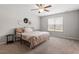 Bedroom with ceiling fan, neutral walls and carpet, natural light and side table at 21 Cambridge Dr, Angier, NC 27501
