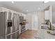Bright kitchen features stainless steel appliances, granite countertops, and wood-look flooring at 21 Cambridge Dr, Angier, NC 27501