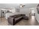 Open-concept living room with hardwood floors, a comfortable couch, and an adjacent kitchen area for easy entertaining at 21 Cambridge Dr, Angier, NC 27501