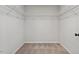 Spacious walk-in closet featuring white wire shelving for optimal organization and ample storage space at 21 Cambridge Dr, Angier, NC 27501