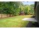 Fenced backyard with a storage shed and a concrete patio at 2129 Ridge Rd, Raleigh, NC 27607