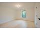 Well-lit bedroom with a window and light hardwood floors creating a bright and airy atmosphere at 2129 Ridge Rd, Raleigh, NC 27607