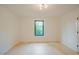 Bright bedroom with a window and hardwood floors showcasing minimalist style and natural light at 2129 Ridge Rd, Raleigh, NC 27607