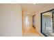 Clean hallway with recessed lighting and large window to the exterior at 2129 Ridge Rd, Raleigh, NC 27607