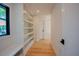Hallway featuring a built-in shelf and a window to the exterior at 2129 Ridge Rd, Raleigh, NC 27607