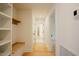Hallway featuring built-in shelving, wooden bench, and recessed lighting at 2129 Ridge Rd, Raleigh, NC 27607