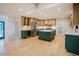 Bright kitchen featuring custom cabinets, stainless steel appliances, wine cooler, and marble countertops on a center island at 2129 Ridge Rd, Raleigh, NC 27607