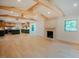 Open concept living space featuring hardwood floors, vaulted ceilings, wooden beams and a modern kitchen at 2129 Ridge Rd, Raleigh, NC 27607