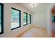 Bright living room has three large windows offering view to the backyard at 2129 Ridge Rd, Raleigh, NC 27607
