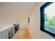 Stylish loft area with natural light and wooden floors, offering a versatile living space at 2129 Ridge Rd, Raleigh, NC 27607