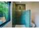 Contemporary bathroom featuring a tiled shower with dual shower heads and a seamless glass enclosure at 2129 Ridge Rd, Raleigh, NC 27607