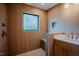 Modern shower featuring wood-textured walls and a rain shower head at 2129 Ridge Rd, Raleigh, NC 27607