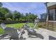 Cozy backyard patio with comfortable seating around a fire pit, ideal for relaxation and entertaining at 217 Tumbling River Dr, Wendell, NC 27591