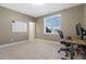 Bright bedroom featuring a large window, neutral walls, and a workspace perfect for productivity at 217 Tumbling River Dr, Wendell, NC 27591