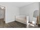 Bright bedroom with light walls, hardwood flooring, and daybed at 217 Tumbling River Dr, Wendell, NC 27591