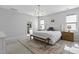 Spacious primary bedroom with natural light, decorative rug, and easy bathroom access at 217 Tumbling River Dr, Wendell, NC 27591