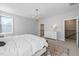 Well-lit primary bedroom featuring walk-in closet and staircase to the upper level at 217 Tumbling River Dr, Wendell, NC 27591