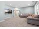 Large bonus room featuring a big sectional couch, recessed lighting, and a TV at 217 Tumbling River Dr, Wendell, NC 27591