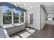 Sunlit breakfast nook boasts a window seat with storage and a modern chandelier at 217 Tumbling River Dr, Wendell, NC 27591