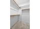 Organized walk-in closet offering ample storage with multiple shelves and rods at 217 Tumbling River Dr, Wendell, NC 27591