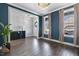 Elegant dining room with dark blue walls, hardwood floors, and a decorative chandelier at 217 Tumbling River Dr, Wendell, NC 27591