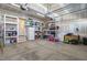 Spacious garage with built-in shelving, providing ample storage space for tools and equipment at 217 Tumbling River Dr, Wendell, NC 27591