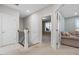 Carpeted hallway with open doorways, and a staircase at 217 Tumbling River Dr, Wendell, NC 27591