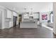 Spacious kitchen with white cabinetry, stainless steel appliances, an island, and pendant lighting at 217 Tumbling River Dr, Wendell, NC 27591
