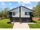 Contemporary duplex with a well-manicured lawn and modern design elements including individual 1-car garages at 2201 Millbank Village Ct # 101, Raleigh, NC 27610