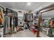 Spacious walk-in closet featuring built-in shelving, hanging racks, and plenty of storage at 2201 Millbank Village Ct # 101, Raleigh, NC 27610