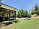 Expansive backyard featuring a covered patio and plenty of green space for outdoor activities at 2725 Belmont View Loop, Cary, NC 27519