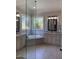Bright bathroom showcasing dual vanities, decorative mirrors and a corner soaking tub with mosaic surround at 2725 Belmont View Loop, Cary, NC 27519