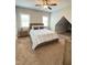 Neutral secondary bedroom with ample space, ceiling fan and an adjoining room at 2725 Belmont View Loop, Cary, NC 27519