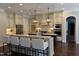 Kitchen boasting granite countertops, island seating, white cabinets, and stainless steel appliances at 2725 Belmont View Loop, Cary, NC 27519