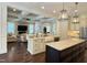 Bright kitchen open to living area, features granite countertops and stainless steel appliances at 2725 Belmont View Loop, Cary, NC 27519