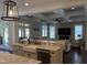 Open kitchen with granite countertops, stainless steel appliances, and an island with seating at 2725 Belmont View Loop, Cary, NC 27519