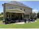 Expansive outdoor patio with ample seating for dining and relaxing near the lush backyard at 2725 Belmont View Loop, Cary, NC 27519