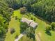 Aerial view of the home, driveway, and surrounding trees at 3000 Hidden Spring Ln, Oxford, NC 27565