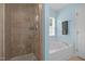 A bright bathroom featuring a separate shower and bathtub at 3000 Hidden Spring Ln, Oxford, NC 27565