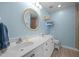 A well-lit bathroom featuring double sinks and a large mirror at 3000 Hidden Spring Ln, Oxford, NC 27565