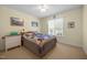 Bedroom with a cozy patchwork quilt, soft carpet, and natural light from the window at 3000 Hidden Spring Ln, Oxford, NC 27565