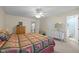 A spacious bedroom with a ceiling fan and an entrance to a bathroom at 3000 Hidden Spring Ln, Oxford, NC 27565