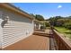 Inviting wooden deck with shade covering and scenic backyard views, perfect for outdoor relaxation at 3000 Hidden Spring Ln, Oxford, NC 27565