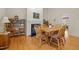 Dining area featuring a fireplace, bookshelves and hardwood floors at 3000 Hidden Spring Ln, Oxford, NC 27565