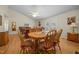 Dining area is open to the living room, featuring hardwood floors and a ceiling fan at 3000 Hidden Spring Ln, Oxford, NC 27565