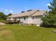 Back exterior of home with deck, siding, manicured lawn, and shrubbery at 3000 Hidden Spring Ln, Oxford, NC 27565