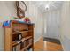 View of the foyer, front door, hardwood floors, and built-in bookcase at 3000 Hidden Spring Ln, Oxford, NC 27565
